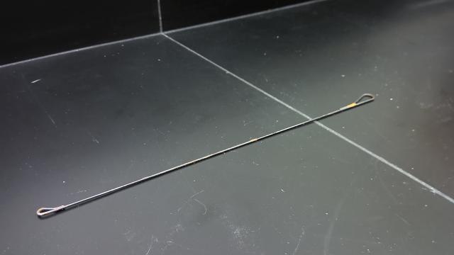 A long, thin metal rod used for compression igniter demonstration
