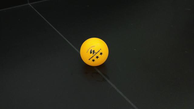Orange ping pong ball used in Bernoulli Effect demonstration