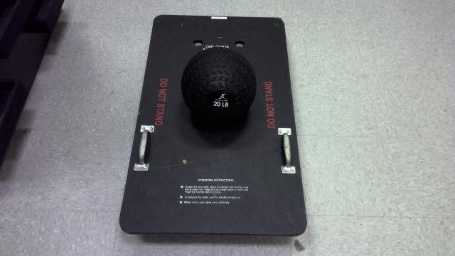 A 20lb medicine ball on top of a low friction cart