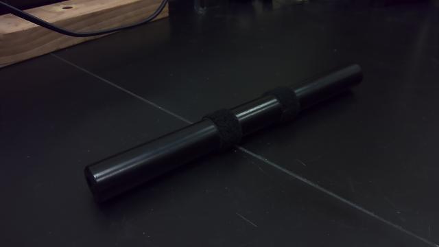A black plunger used in the conservation of momentum demonstration